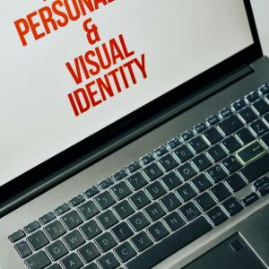 Laptop screen showing text on brand personality and visual identity for marketing strategy.